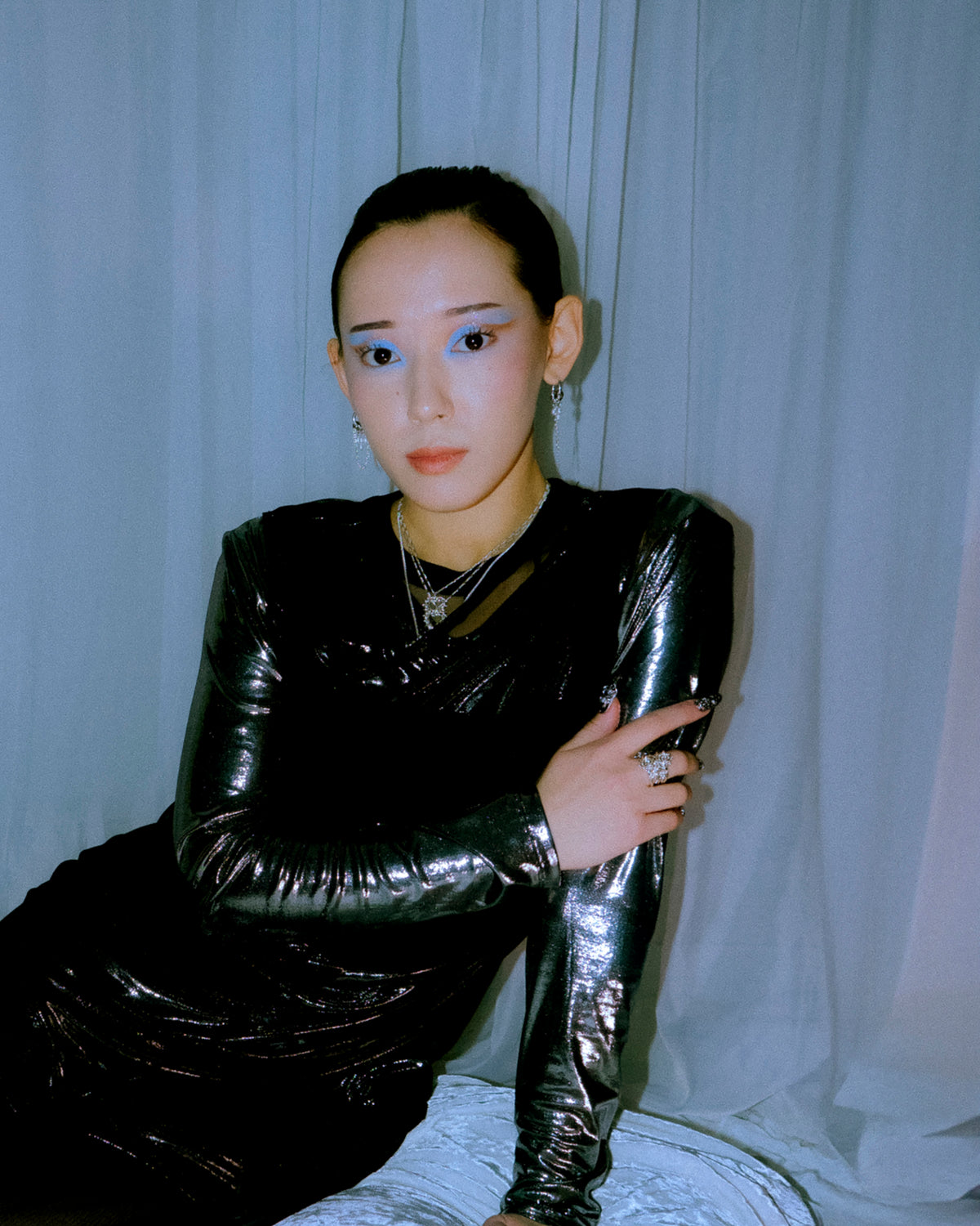 Dark Siren pearl earrings worn on a model