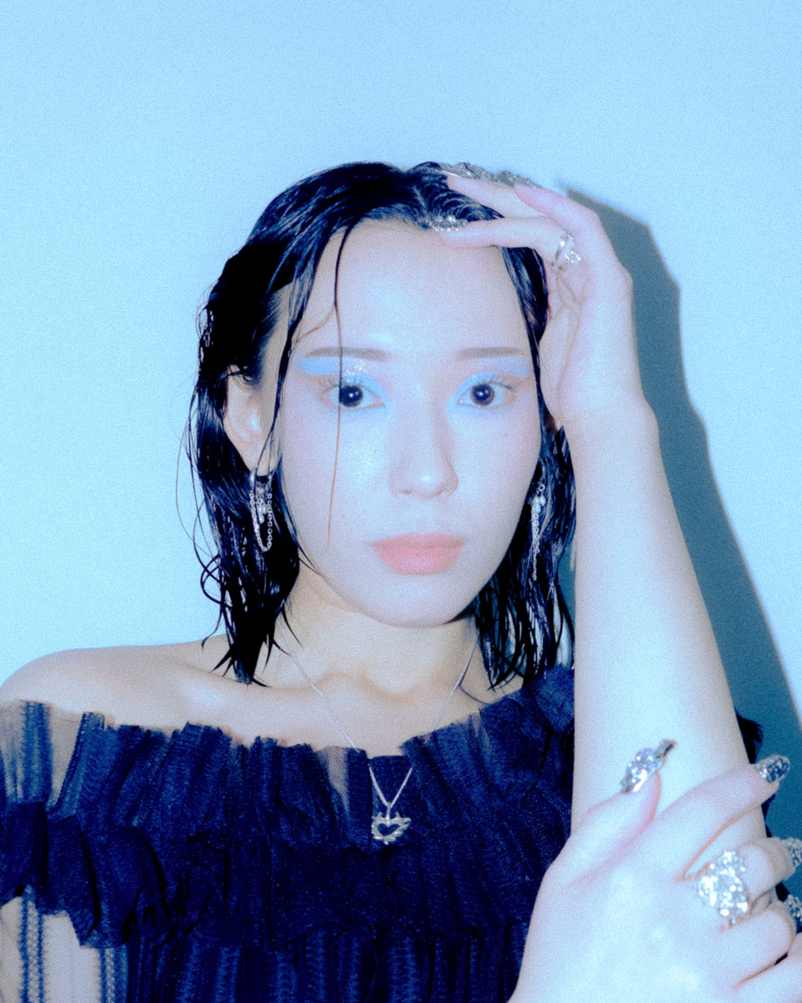 Dark Siren baroque pearl earrings styled at the ear