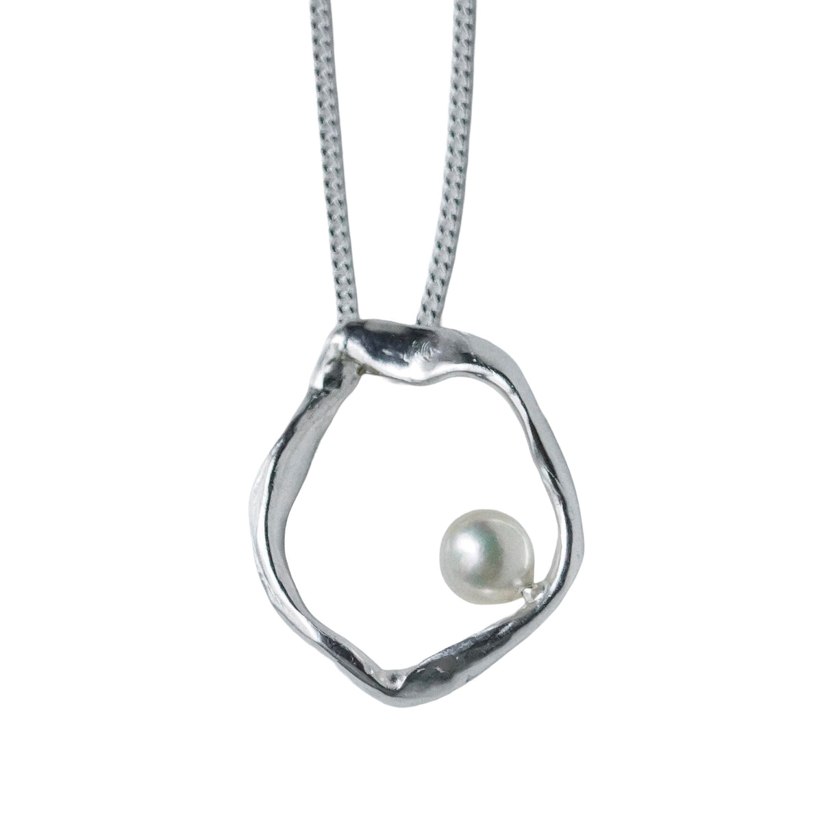 Close-up of Mother organic sterling silver pearl pendant