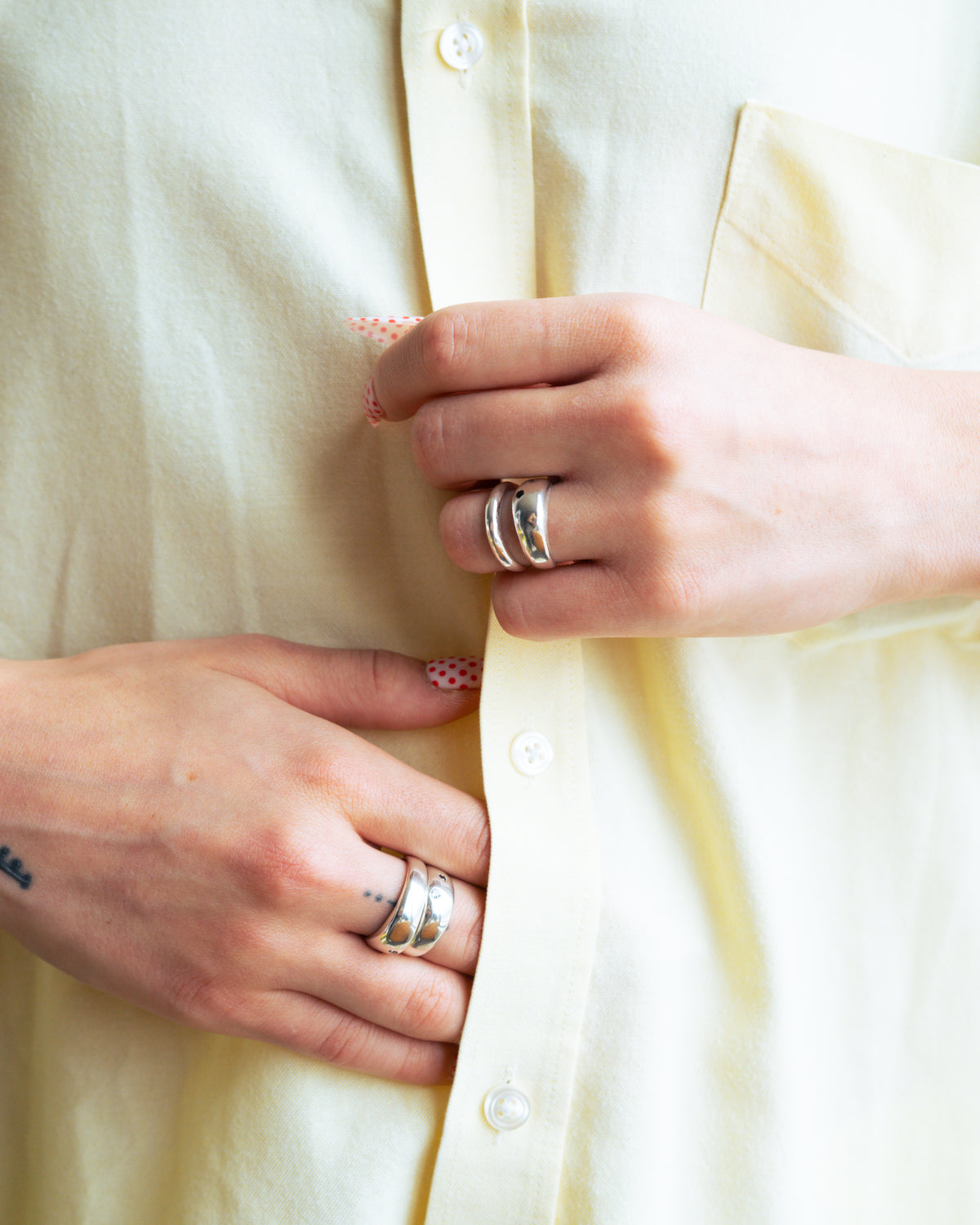 Ace Ring worn on the hand with black spinel and clear CZ