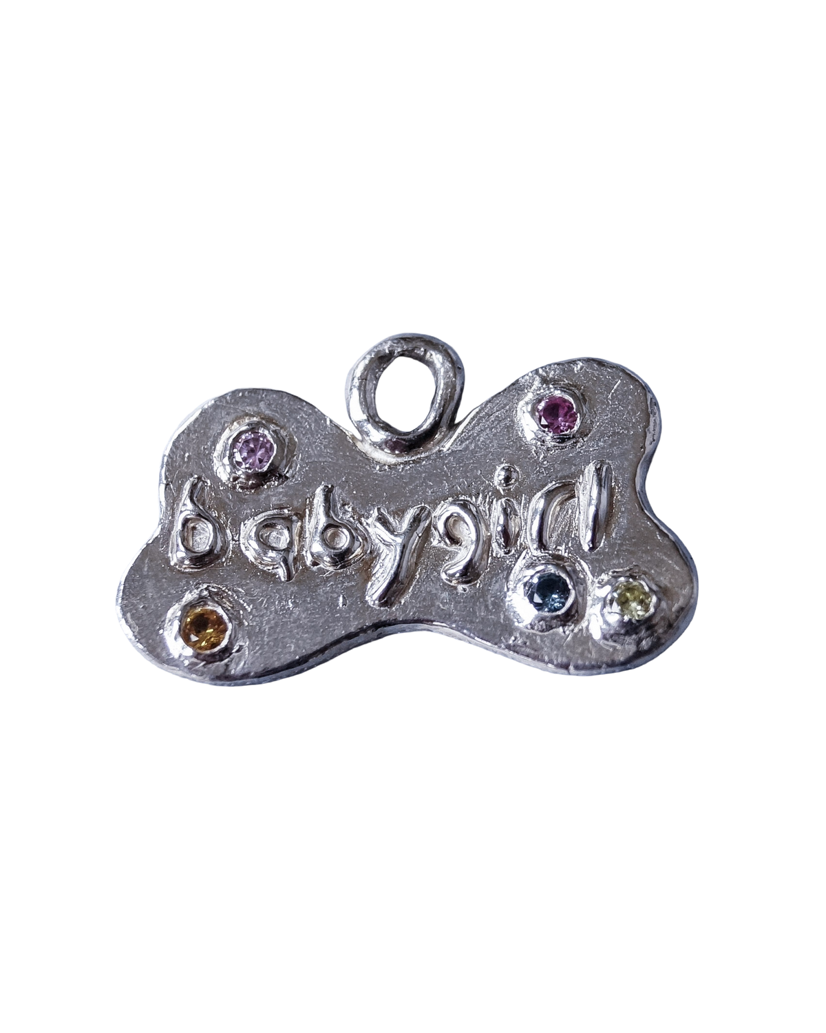 Close-up of a custom bone-shaped sterling silver pet tag with colourful CZ gemstones