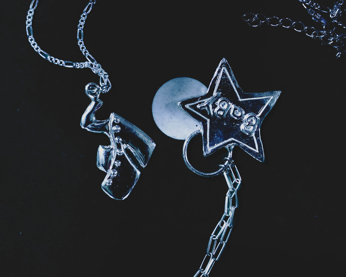 Sky High platform shoe pendant styled with a sterling silver star necklace