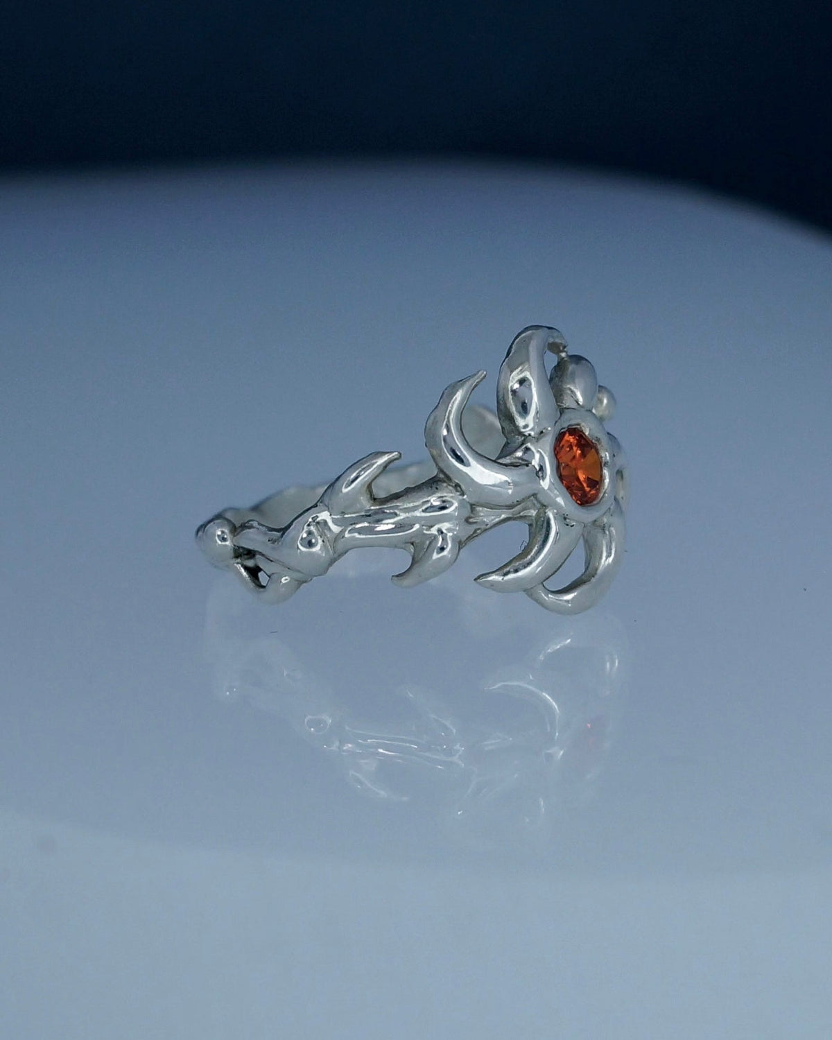 Orange cubic zirconia Sunnie Ring styled on the hand