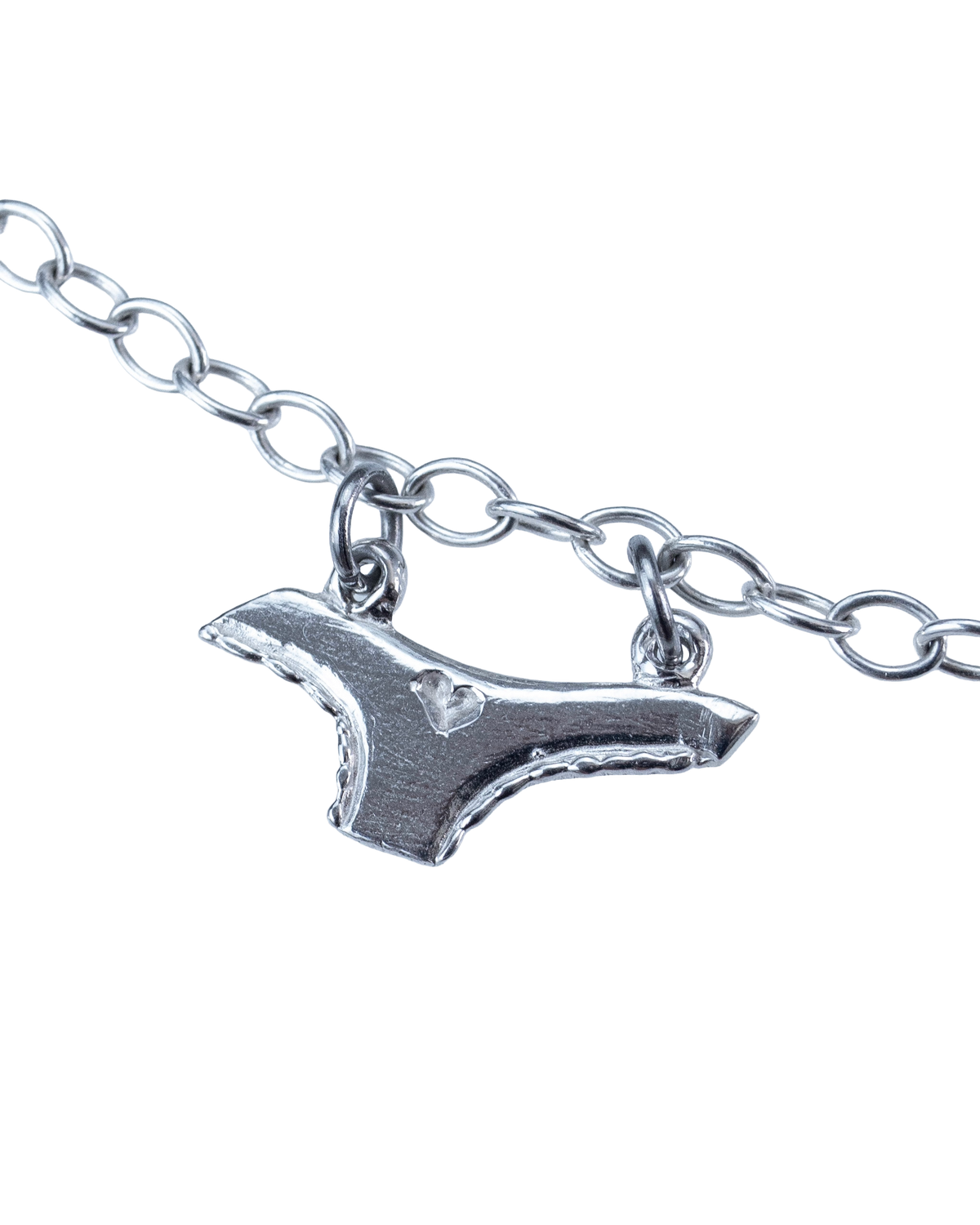 Close-up of a sterling silver underwear charm on the Clothesline necklace