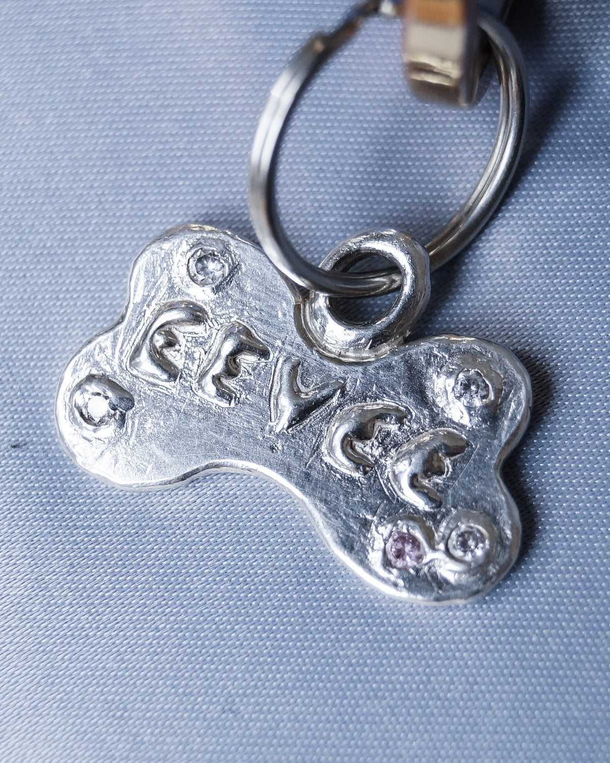 front view of custom sterling silver pet ID tag showing engraving area and polished finish