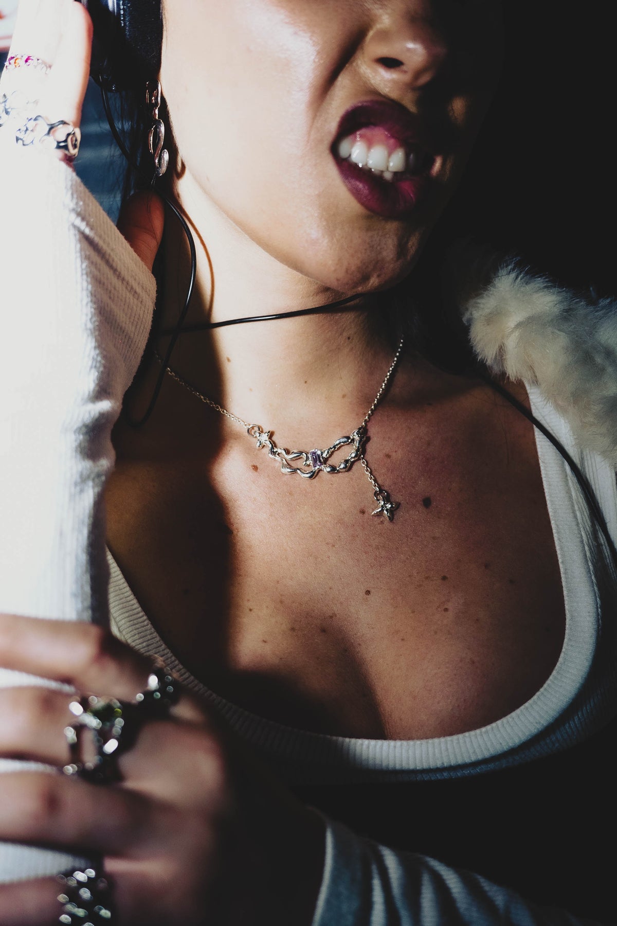Close-up of the Faerie Chain sculptural pendant worn on the neck