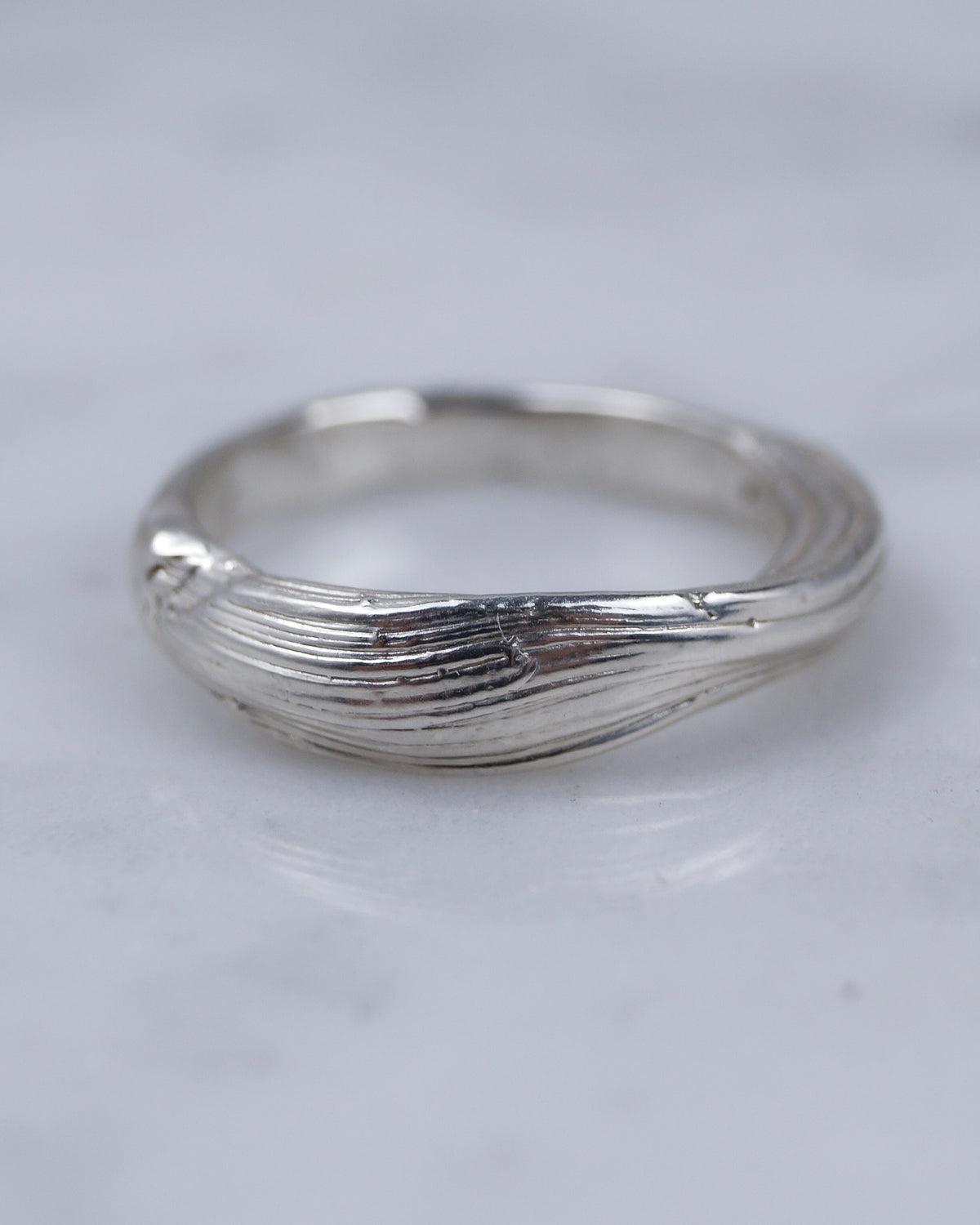 Close-up of the layered folds on the Fold 003 sterling silver ring