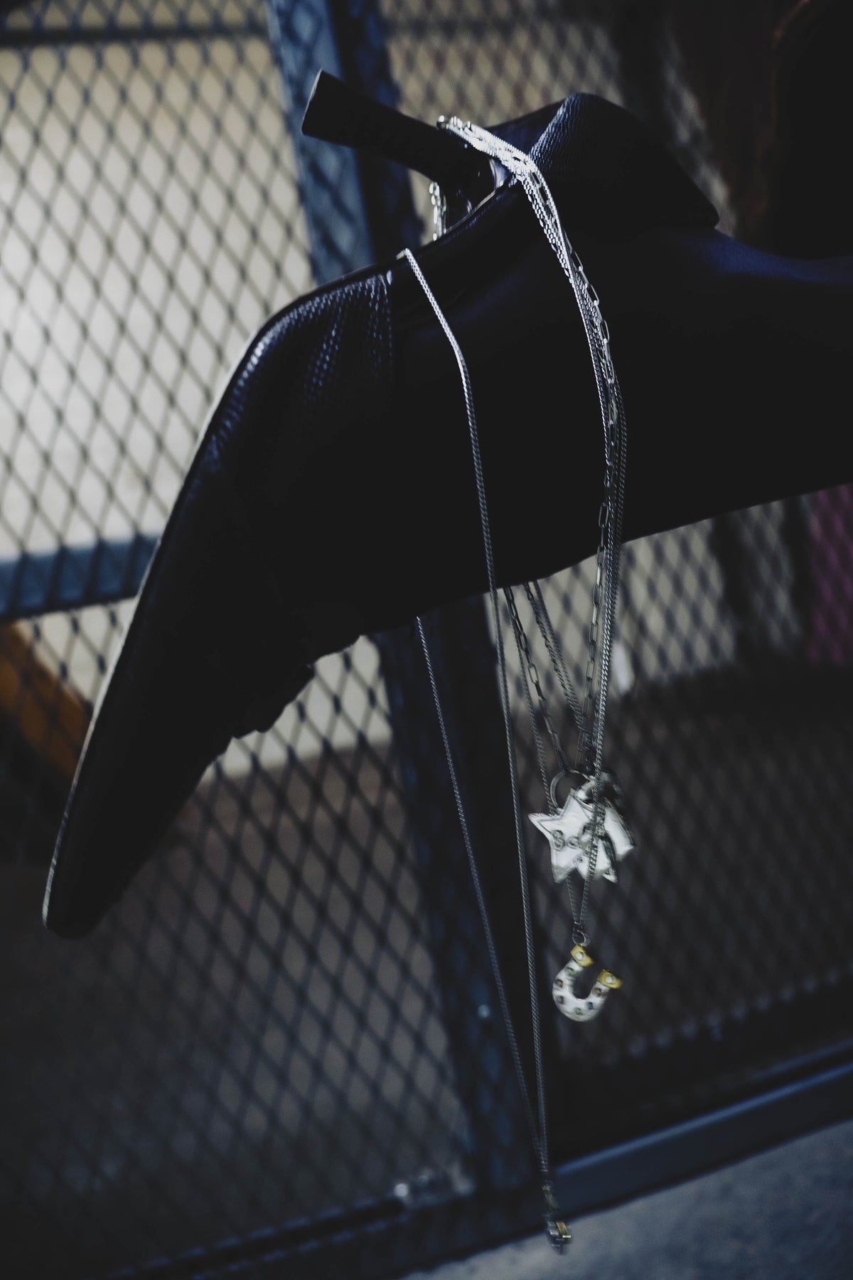 Lucky You horseshoe pendant necklace styled with a black shoe