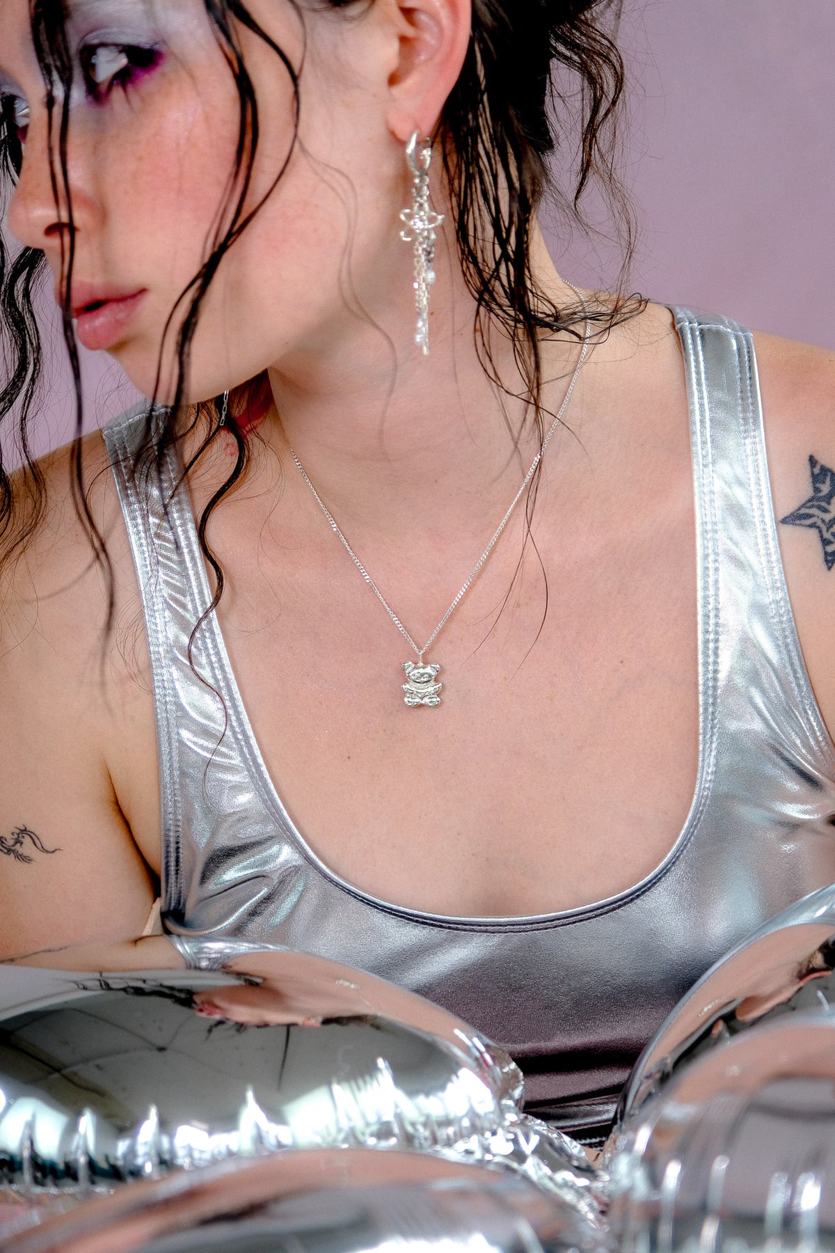 Teddy silver bear necklace worn at the neckline