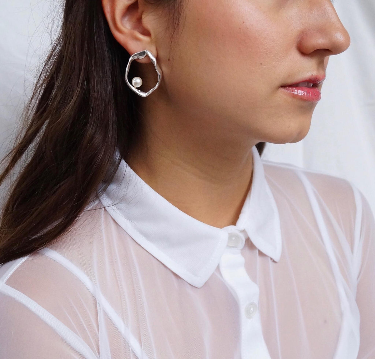 Daughter Earrings worn on a model