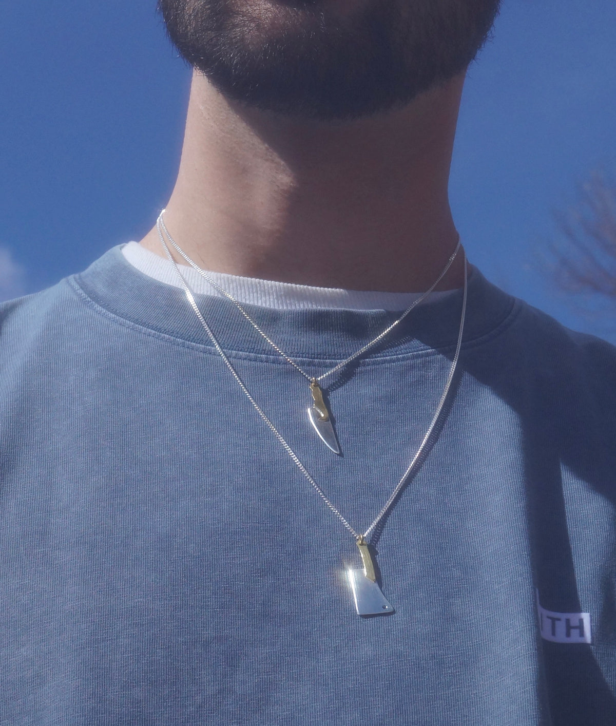 Sculptural Butcher Blade necklace styled on a model